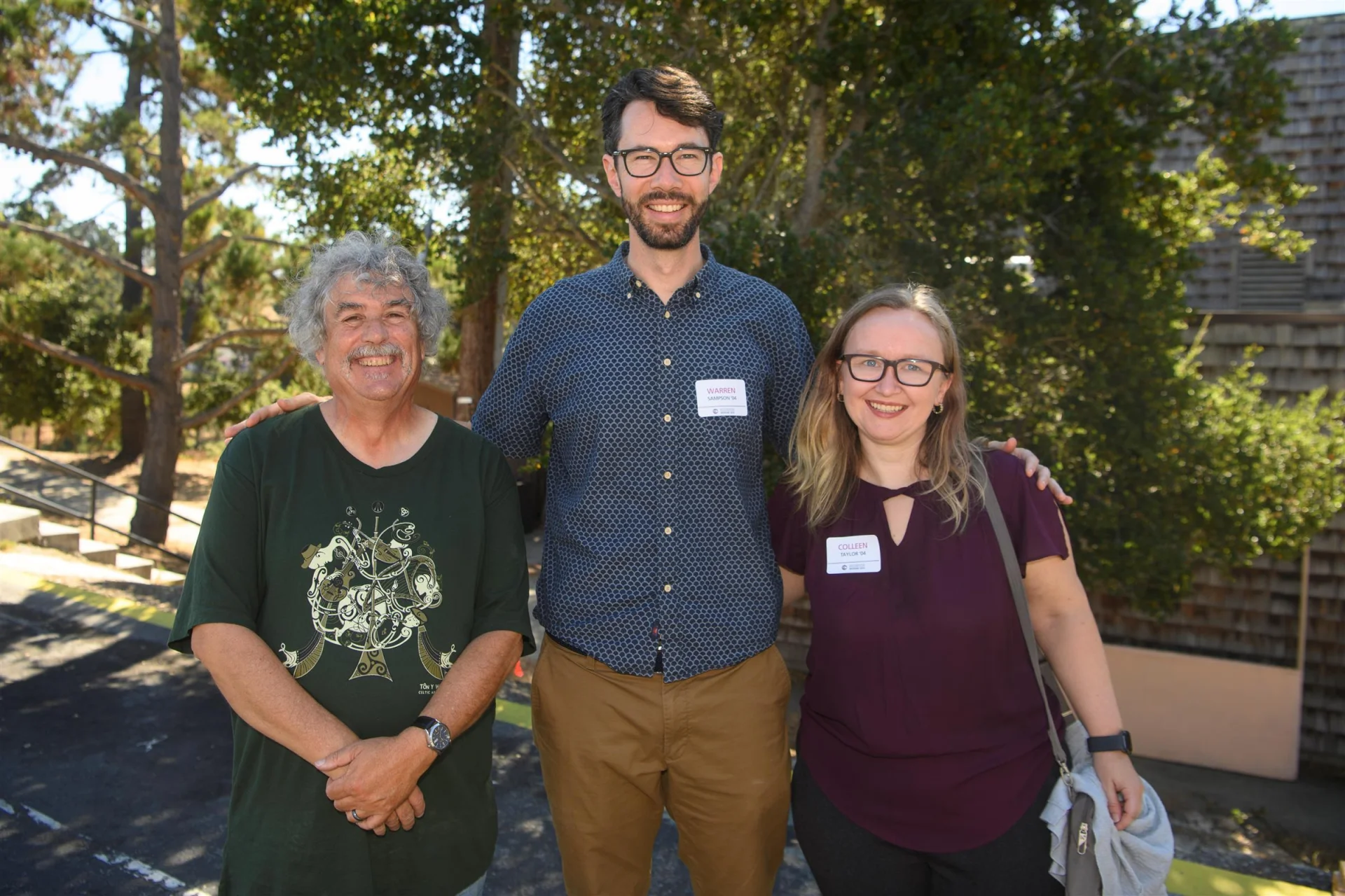 group of 3 alumni smiling