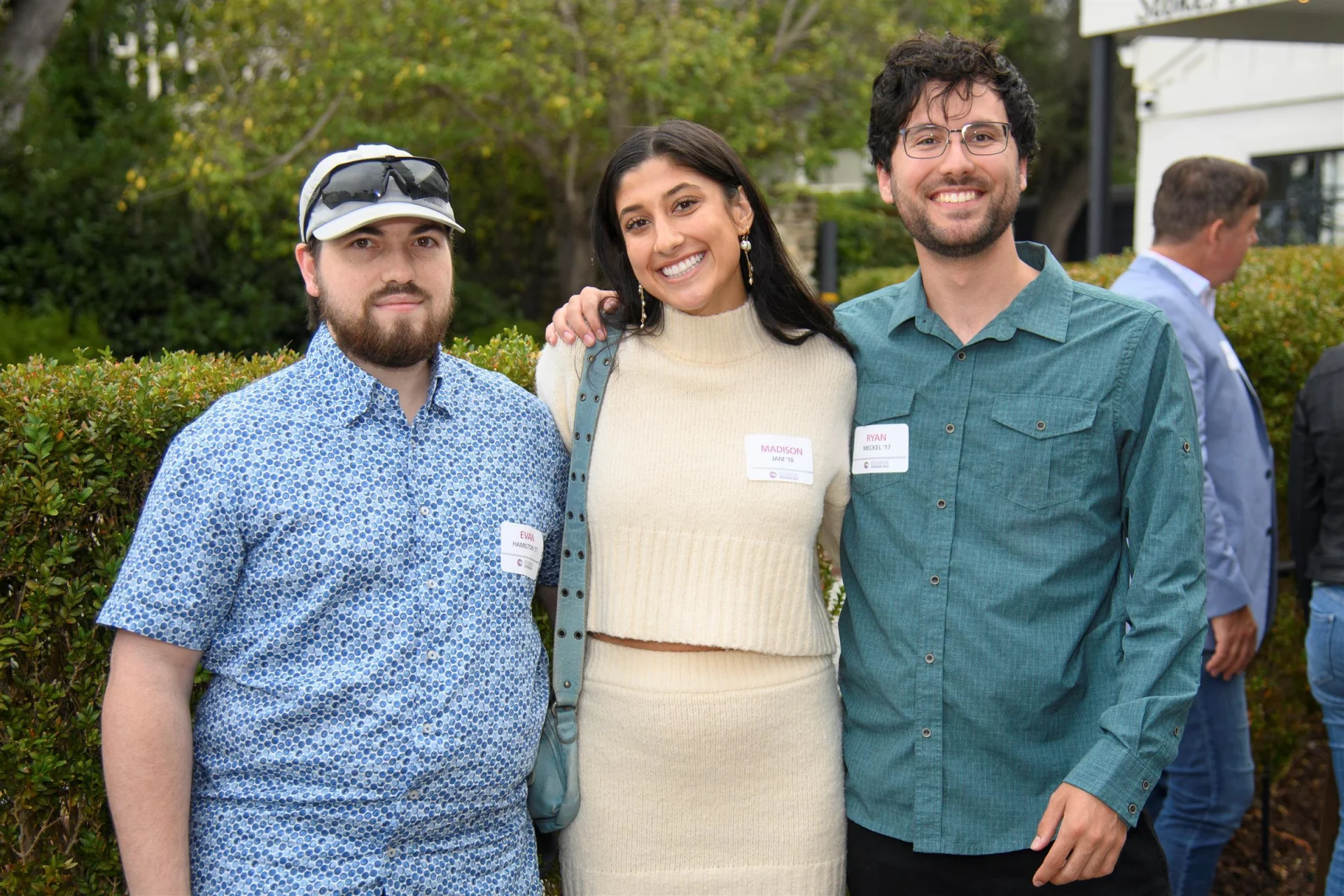 group of 3 alumni smiling