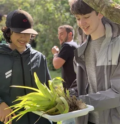 two students working outdoors