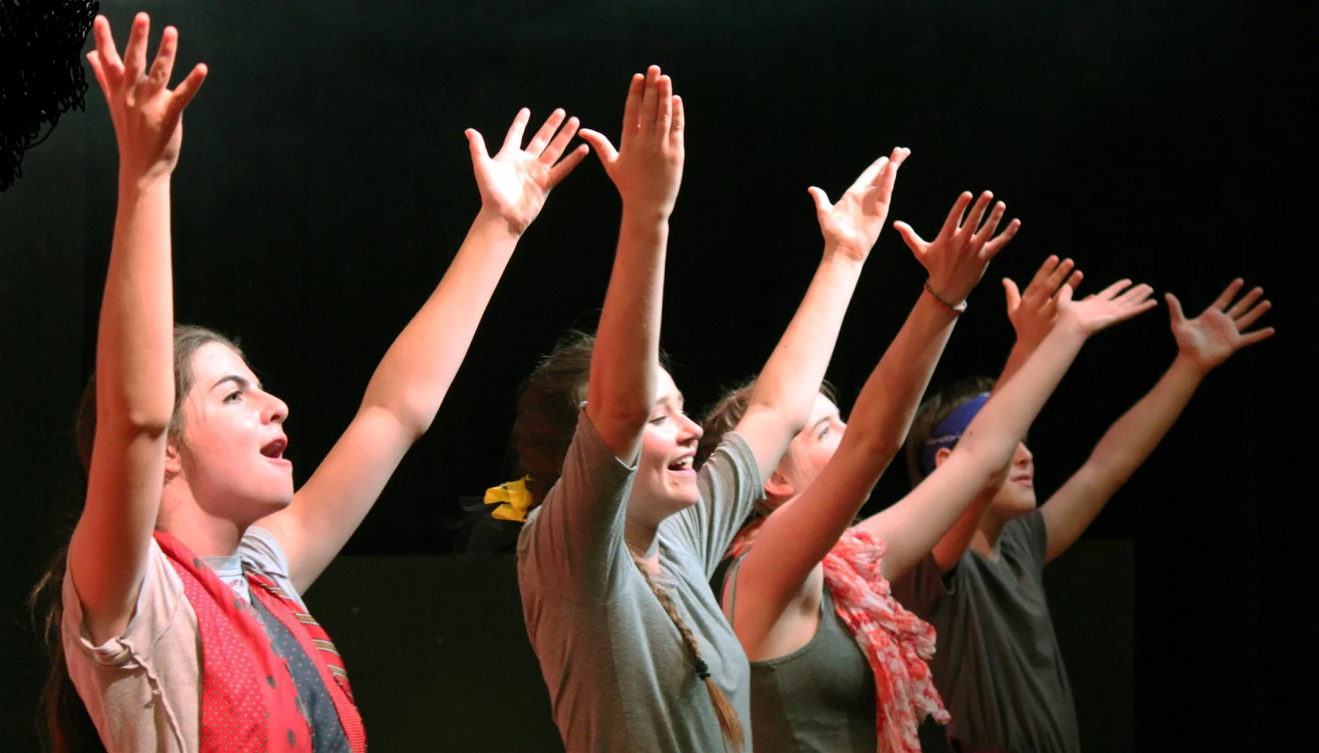 students performing on stage